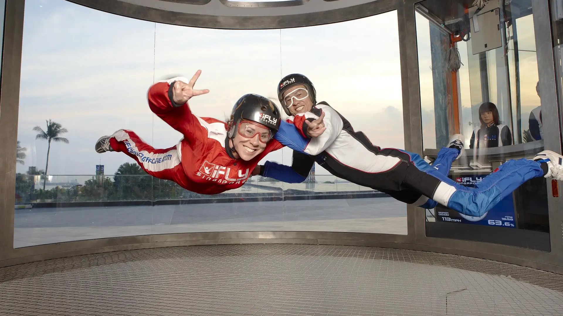 Indoor skydiver floating inside the iFly Singapore wind tunnel on Sentosa Island.
