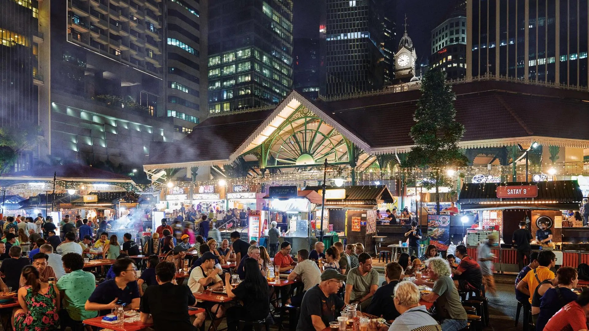 Lau Pa Sat hawker centre bustling with evening diners in Singapore’s city centre.
