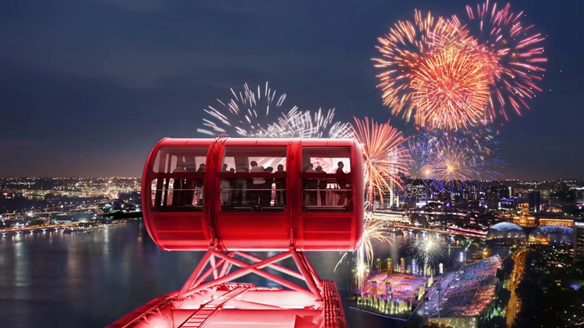 Fireworks lighting up Marina Bay with the Singapore Flyer in the background.