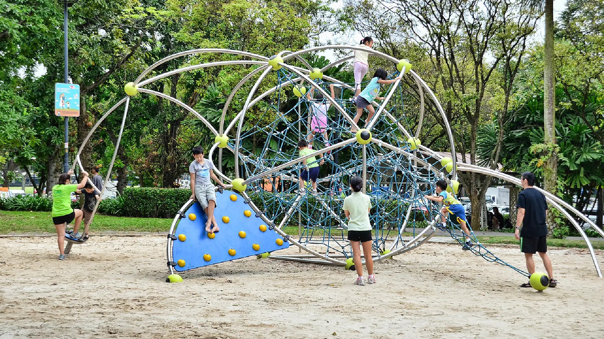 Kids exploring the rope climbing pyramid at West Coast Park, one of Singapore’s most popular family outdoor playgrounds.