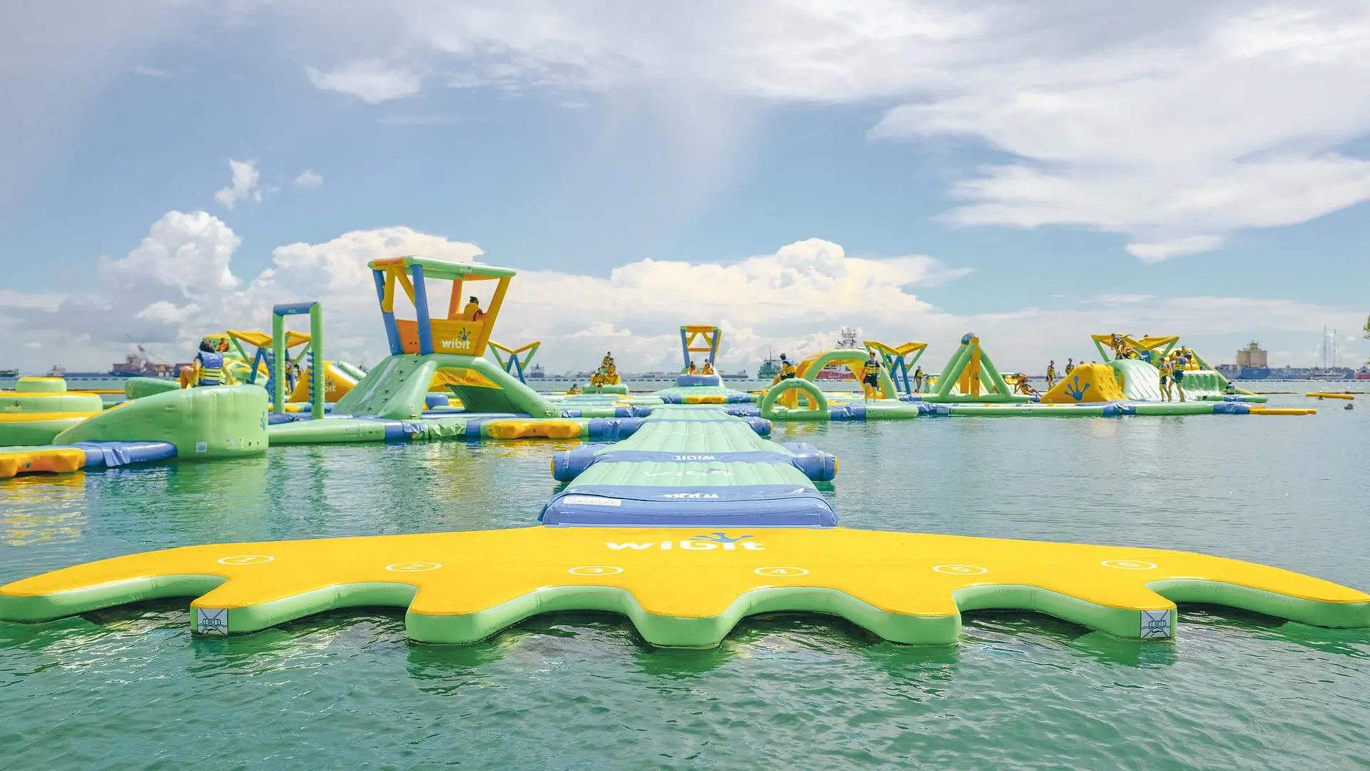Inflatable obstacle course at HydroDash floating aqua park, a popular outdoor water activity for kids and families in Singapore.