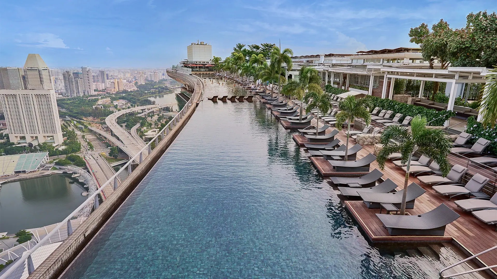 Iconic Marina Bay Sands infinity pool overlooking the Singapore skyline, with panoramic city views from the SkyPark.