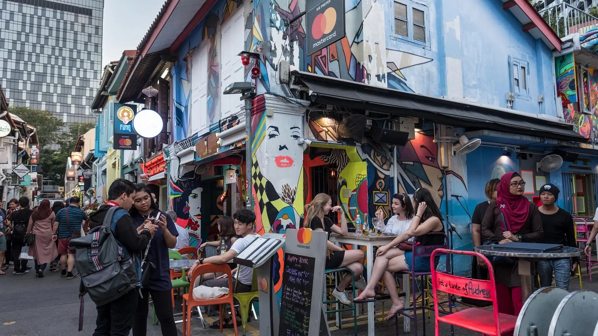 Street art–covered shophouses and busy cafés along Haji Lane in Kampong Glam, one of Singapore’s trendiest neighbourhoods.