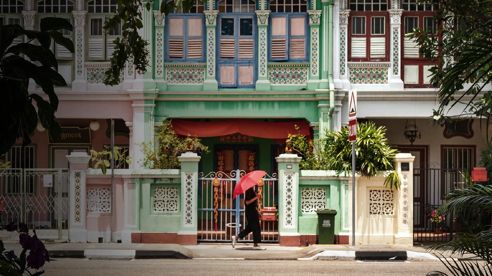 Pastel Peranakan shophouses lining a quiet street in Joo Chiat, showcasing Singapore’s heritage architecture and local charm.