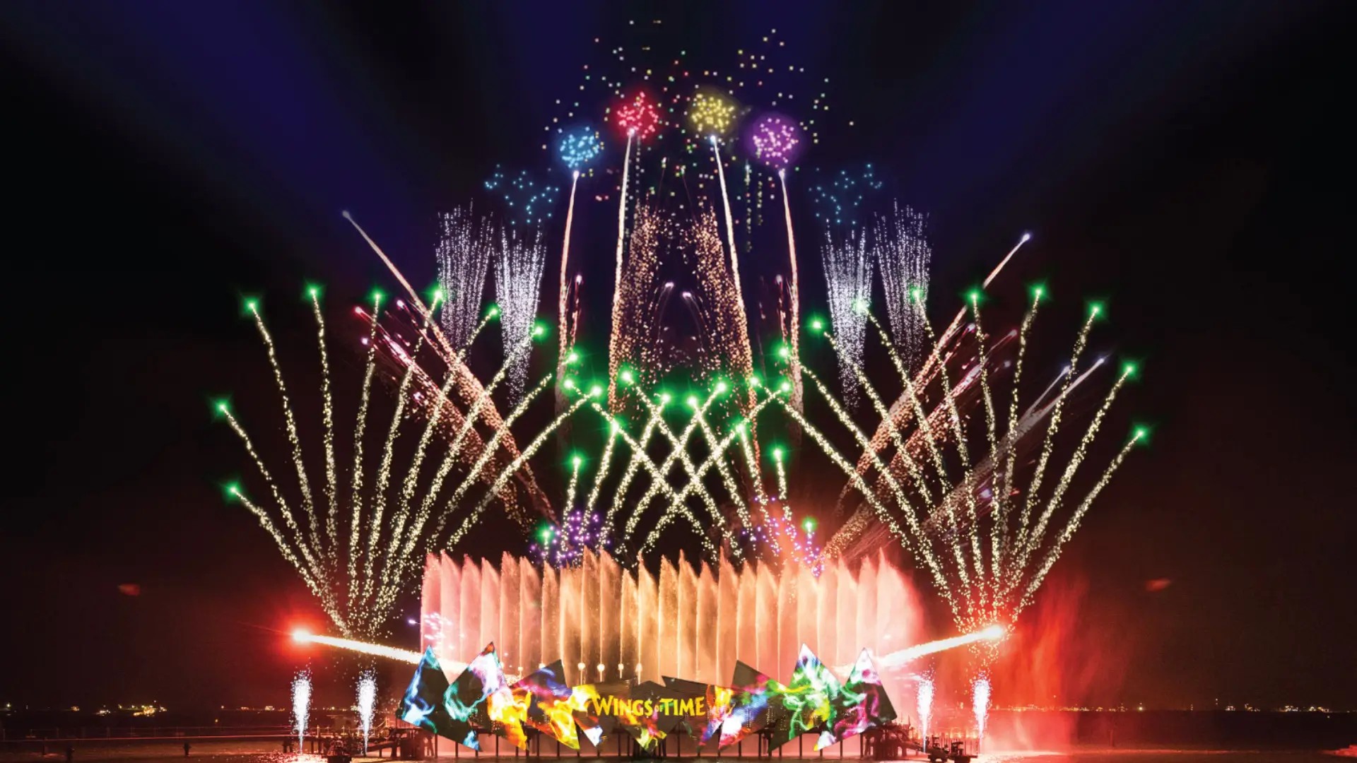 Wings of Time night show at Sentosa featuring fireworks, water fountains, lasers, and light effects over the sea, creating a spectacular evening performance in Singapore.