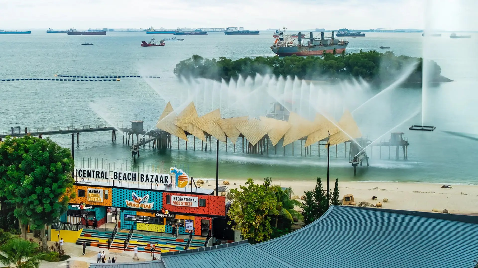 Central Beach Bazaar at Siloso Beach with food stalls, beach clubs, ocean views, and evening atmosphere in Sentosa Singapore