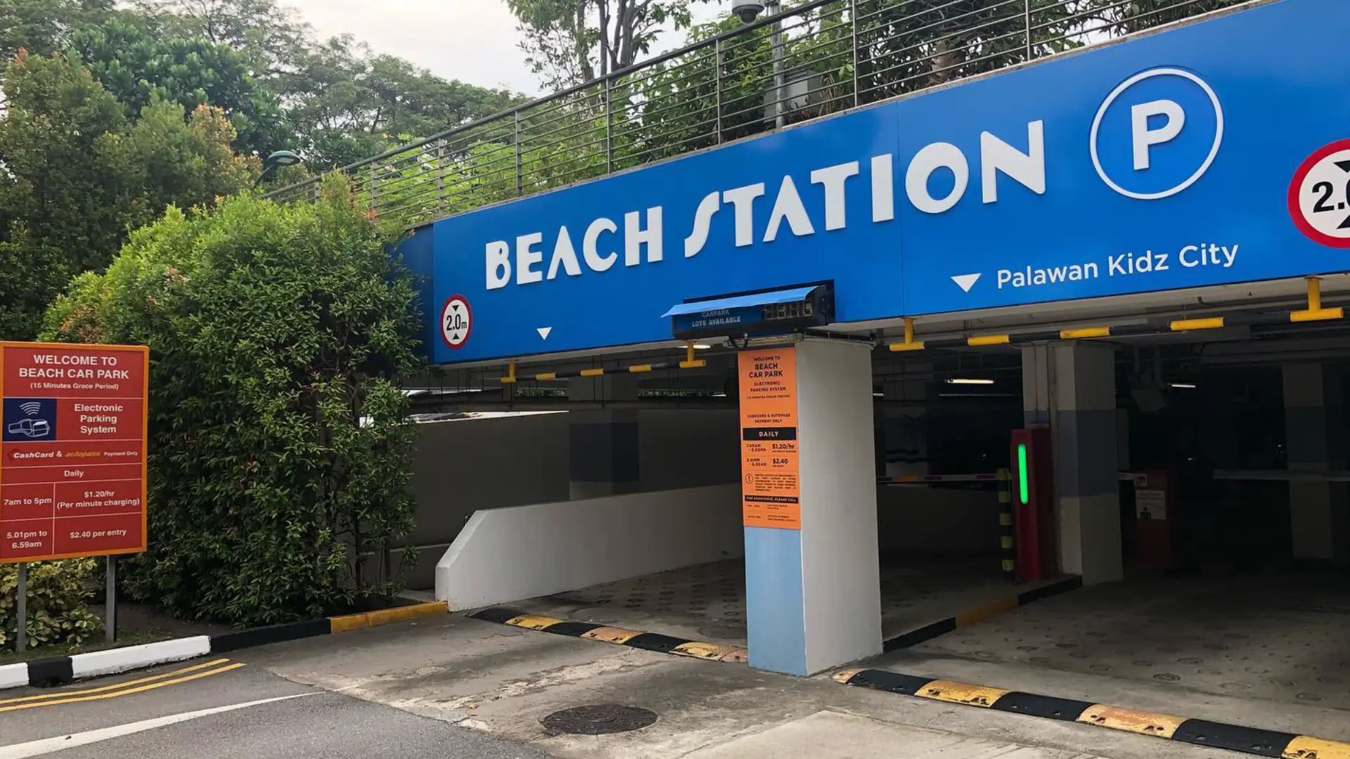 Beach Station car park entrance on Sentosa Island with parking signage and vehicle entry lanes