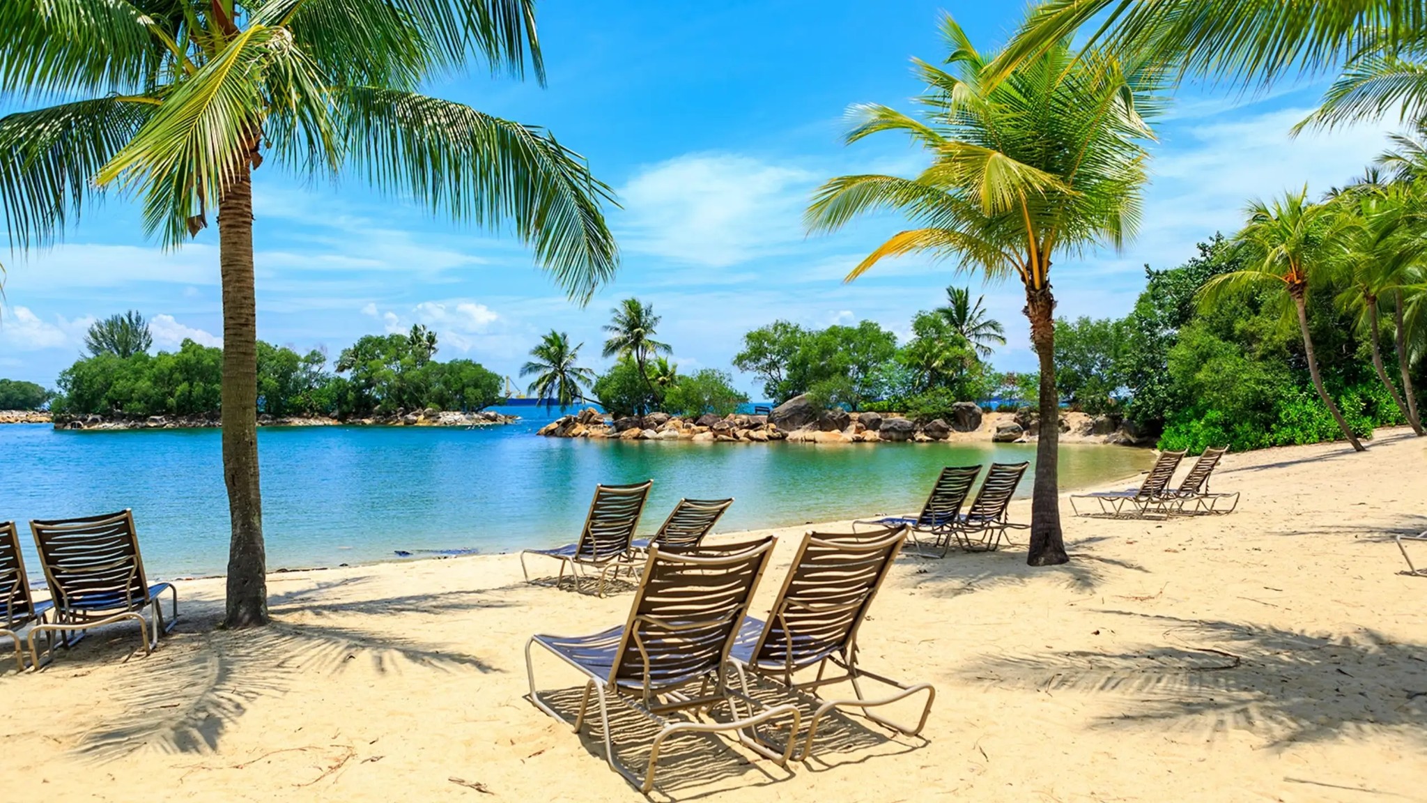 Panoramic view of Sentosa Island showing beaches, attractions, and tropical greenery near Singapore.