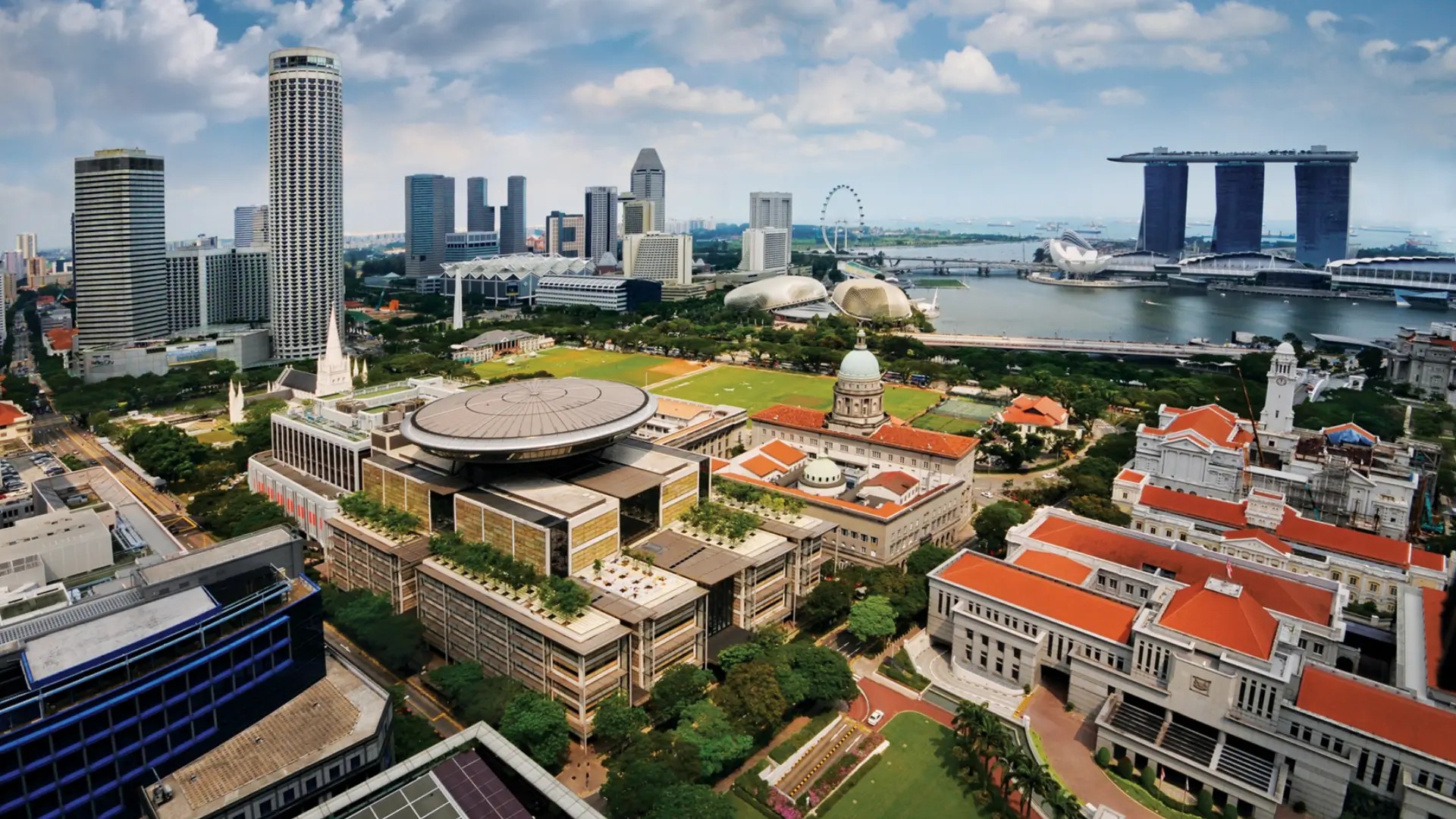 Aerial view of Marina Bay and Singapore’s Civic District with Marina Bay Sands and historic landmarks