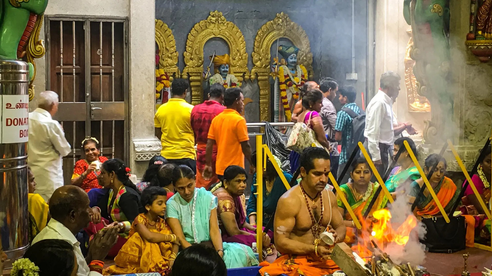 Worshippers taking part in a Hindu temple ritual in Little India, Singapore
