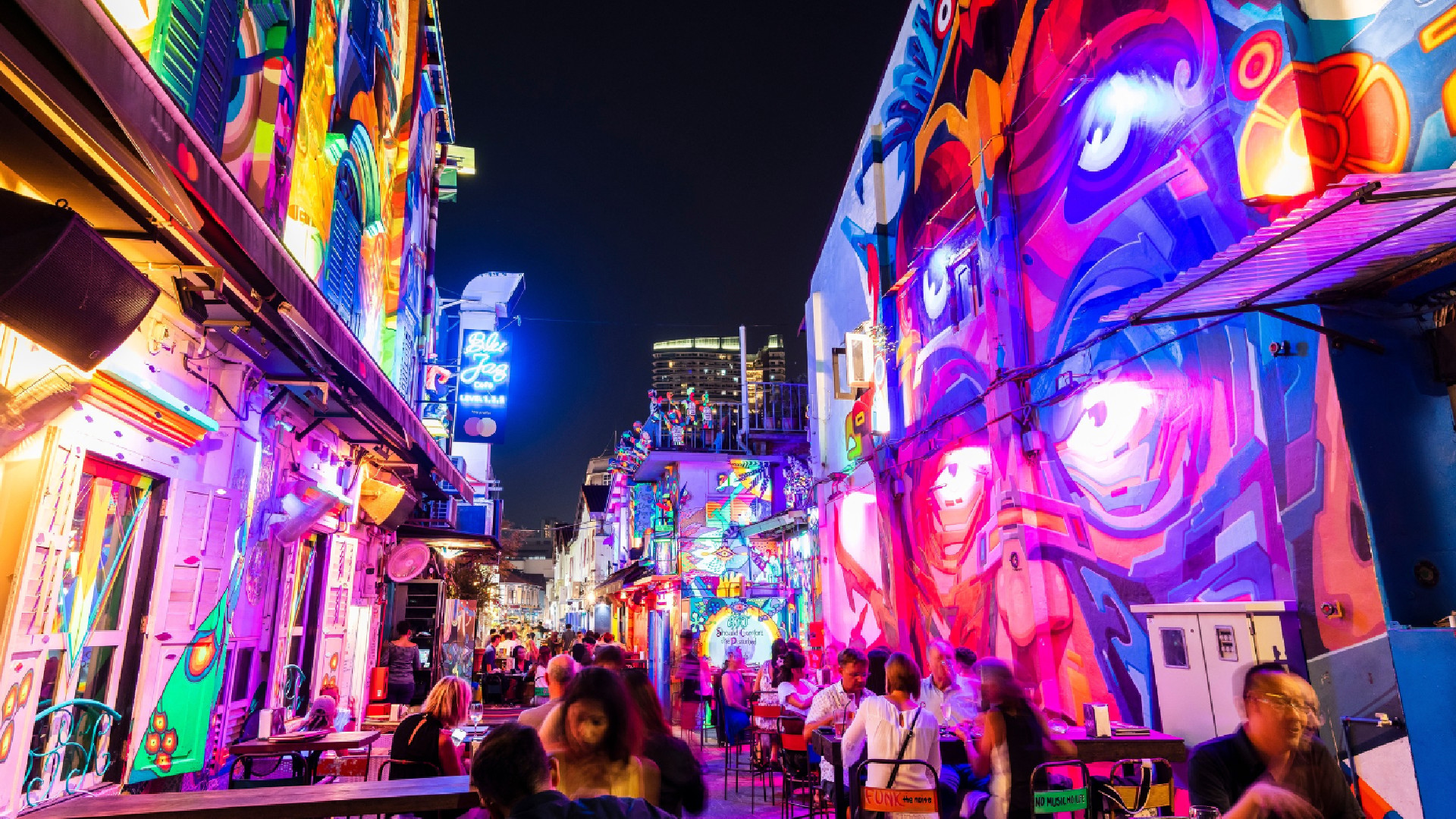 Haji Lane in Kampong Glam at night with colourful street art, cafés and lively nightlife in Singapore