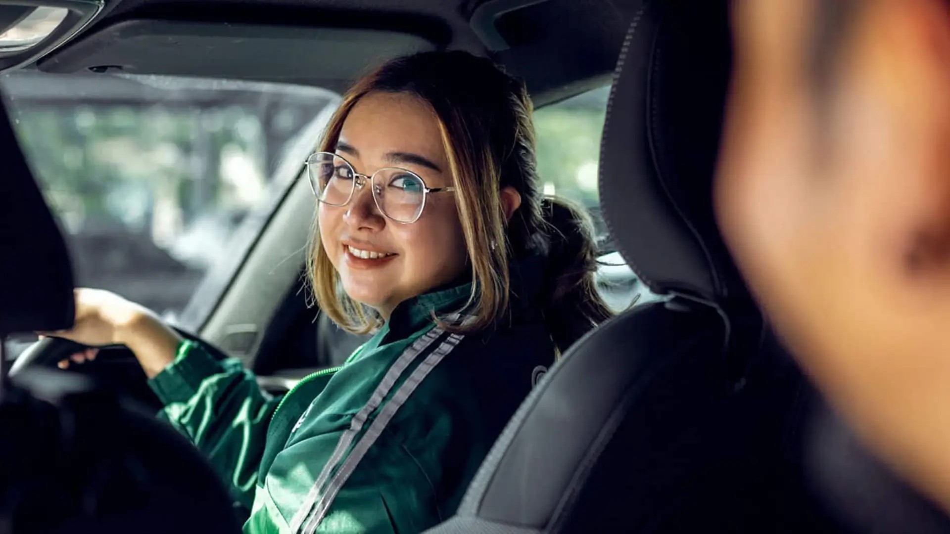 Passenger travelling in a car using Grab.